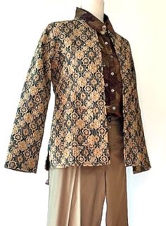 This jacket is part of our new specialty collection which redefines handcrafted artisan fashion. Traditional waistcoat cut, tab collar with 2 front pockets. One of the favorites, known for it's slimming look. Button down front, wear open or closed. This kantha pattern is hand printed with incredible detailing. Designer finishes. Long sleeves may be rolled or folded based on your desire. Stunning blend of colors, one side printed in a geometric print in bronze, honey and charcoal. The reverse print, small geometric linear pattern in olive, mustard and bronze. Incredible value from a recognized artisan. This waistcoat jacket is the traditional cut and considered a classic that will be worn and appreciated for years to come. Made with the highest caliber of materials and exhibits several diff Kantha Pattern, Fashion Traditional, Artisan Fashion, Linear Pattern, Hand Print, Dominican Republic, Geometric Print, Bosnia And Herzegovina, Long Sleeves