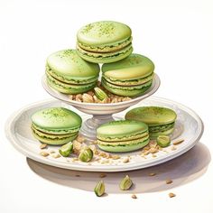 a painting of green macaroons and nuts on a white platter with two plates