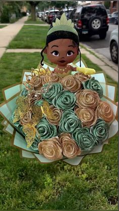 Princess and the Frog, 24 ct, glitter rose bouquet with add ons!  evesforeverflowers on ig 🤍. Princess And Frog Bouquet, Princess Tiana Bouquet, Disney Princess Bouquet, Princess And The Frog Flowers, Princess And The Frog Flower Bouquet, Princess And The Frog Bouquet, Frog Bouquet, Tiana Quince