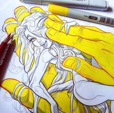 a drawing of a woman in yellow and red with two crayons next to it