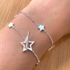 Star Bracelet Silver, Sterling Silver Toggle Bracelet, Celestial Bracelet, Friendship Bracelet, Bridal Bracelet, Bridesmaid Bracelet, Gift No one can resist this piece of sparkling stars lariat bracelet! Presented with big and tiny stars all along the bracelet, it definitely catches a lot of attention on your wrist! The lariat design makes the bracelet very adjustable and fit. Find the matching anklet following this link: https://www.etsy.com/listing/224186639/925-sterling-silver-shining-stars-a Silver Star Bracelet For Friendship, Silver Bracelet With Star Charm For Friendship, Silver Bracelets With Star Charm For Friendship, Silver Friendship Bracelets With Star Charm, Silver Star Charm Jewelry For Friendship, Celestial Bracelet, Silver Star Bracelet, Silver Market, Bridesmaid Bracelet Gift