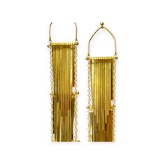 These stunning waterfall tiered metal drop earrings are a work of art. Made of three tiers of metal strands they remind us a bit of the flapper dress in the way the strands move with a toss of one's head. Handcrafted in brass metal, these earrings are truly unique, and did we say statement making? They are certainly shoulder graziers. The artist made three pairs, which we have here, so stock is extremely limited. These earrings were made with festivities in mind. We found a family of artisans, and fell in love with their tremendous talents and creative use of materials, not to mention their beaming smiles. Details: Waterfall tiered metal drop earrings with hook fastenings for pierced ears. These earrings are on the heavier side, a factor for individuals with sensitive ears to consider. Siz