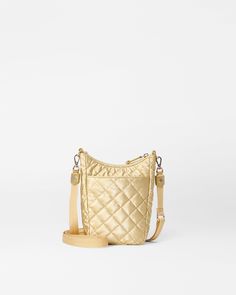 Designed for days and nights on the go, the compact Crosby Go has a scoop zip top, an interior phone pocket, and a hidden outer zip pocket on the back. Like all Crosby bags, Crosby Go has three strap options to go with every look. Gold Quilted Travel Bag, Beige Interior, Mz Wallace, Quilted Handbags, Mens Fragrance, Black Cross Body Bag, Gold Leather, Gold Pearl, Tote Backpack