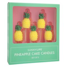 four pineapple cake candles in a box