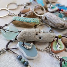 a collection of sea glass and jewelry on a table