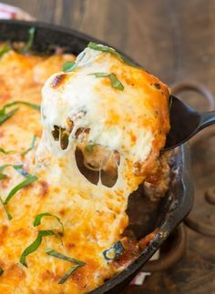 a skillet filled with cheesy bread and cheese