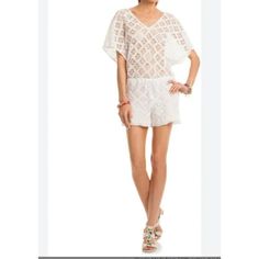 This Trina Turk Beach Cover Up Is A Chic Addition To Your Swimwear Collection. Size 14, It Features A White Crochet Lace Design, Perfect For Stylishly Transitioning From Beach To Bar. Size 14 White Crochet Lace Design Lightweight And Breathable Comfortable Fit Versatile Beach To Bar Style Excellent Newcondition. Ships From A Smoke Free Location. Measurements Taken With Item Laying Flat Bust Measurement Doubled. Bust 48 Inches Inseam 4 Inches Features: Romper/Cover Up Size: Womens 14 Condition: N Casual White Cover-up With Crochet Trim, Spring Beachwear Crochet Lace Top, Spring Lace Crochet Top For Beachwear, Beach V-neck Lace Crochet Top, Lace Crochet Top For Beachwear On Vacation, Chic Crochet Top For Beach, Chic Crochet Trim Top For Beach, Beach Crochet Lace V-neck Top, Summer Beachwear Tops With Lace Trim