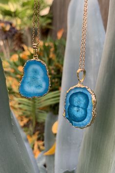 Beautiful gold plated blue banded Stalactite Agate Slice pendant on gold plated clasp chain necklace. The crystal is approximately 1.25 inches long and 1 inch wide. Please note that every stone is unique, therefore color, shape and/or size may vary slightly. You can choose your necklace length from the drop-down menu. In case you would like a length besides the listed options, leave a note at checkout. Item will be shipped 1 - 2 business days after purchase. Back to my shop with its variety of b Gold Agate Jewelry With Large Pendant, Gold Necklaces With Natural Stones And Chalcedony, Gold Necklaces With Natural Stones In Chalcedony, Gold Chalcedony Necklace With Natural Stones, Blue Agate Pendant Jewelry, Blue Chalcedony Spiritual Necklace, Blue Spiritual Gold-plated Necklaces, Blue Agate Gemstone Necklace, Blue Agate Gemstone Necklaces