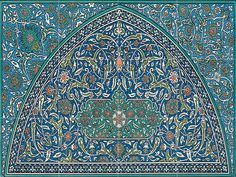 an intricately decorated blue and green tile