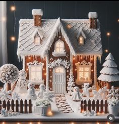 a gingerbread house is decorated with lights and decorations