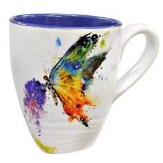 a coffee cup with a butterfly painted on it