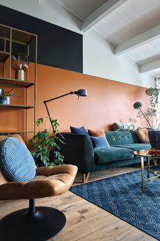 a living room filled with furniture and a blue rug