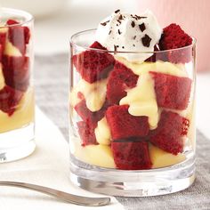 red velvet dessert with whipped cream and toppings in small glass dishes next to silverware