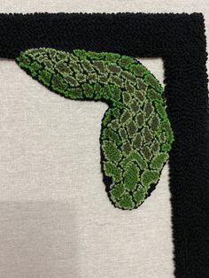 a piece of art that is made to look like an image of a green leaf