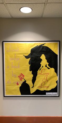 a large yellow poster hangs on the wall