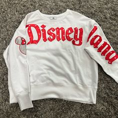 New With Tags Womens Disneyland White Crew Neck Size L With Red Lettering Across The Chest And Down The Sleeve With Minnie Mouse Head On The Other Sleeve Disney Crewneck Sweatshirt, Nightmare Before Christmas Sweater, Minnie Mouse Head, Minnie Mouse Sweater, Light Knit Sweater, Jersey Sweater, Crewneck Sweatshirt Women, Green Crewneck, Disney Sweaters