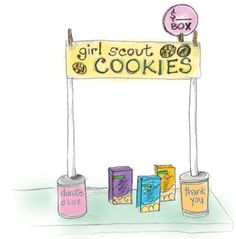 a sign that says girl scout cookies and some kind of box with candy on it