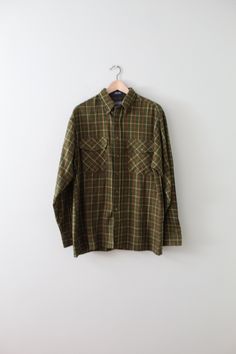 Vintage warm oversized flannel feel acrylic shirt in moss green check print. Large envelope pockets. Circa 1990s 17" shoulders  44" bust 30" length Condition: excellent! Green Checkered Shirt, Green Checkered, Large Envelope, Grunge Shirt, Oversized Flannel, Fall Inspiration, 90s Shirts, Checkered Shirt, 90s Grunge