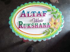 a sign that says aftaf weds rukshanana on it with flowers and leaves