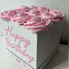 a large white box with pink flowers on the inside and happy birthday written on it