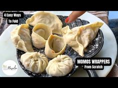 a plate filled with dumplings on top of a table