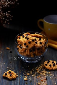 chocolate chip cookies in a glass bowl on a wooden table