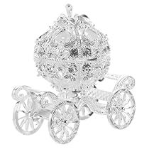 a small silver carriage with wheels on it's back and the front wheel is made out of crystal stones