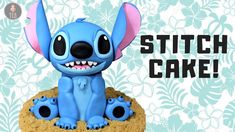 a small blue toy sitting on top of a cookie with the words stitch cake written above it