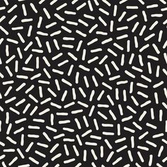 an abstract black and white pattern with small dots on it's surface, in the middle