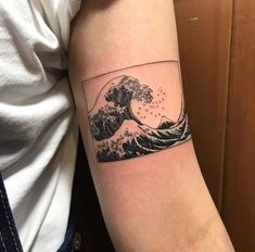 the great wave tattoo on the arm