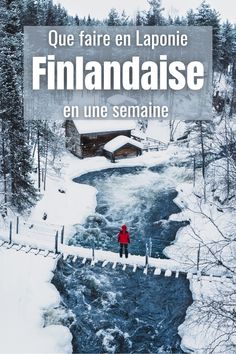 a person standing on a bridge over a river in the middle of snow covered ground