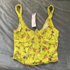 Nwt Urban Outfitters Uo Carlyn Tank Top Size S A Cropped Tank Top From Uo. Cut With A Scoopneck. Cropped Just Above The Waist. Finished With Wide Straps And A Curved Hem. Color: Gold (Via Uo Website) 96% Polyester, 4% Spandex No Flaws/Damages To Lists. See Pics For Approx Measurements/Details/Condition. Send Me A Reasonable Offer :) Yellow Urban Outfitters Top For Vacation, Urban Outfitters Yellow Tops For Spring, Yellow Urban Outfitters Top For Spring, Fitted Yellow Top From Urban Outfitters, Yellow Halter Top, Fringe Tank Top, Urban Outfitters Top, Purple Tank Top, High Neck Tank Top