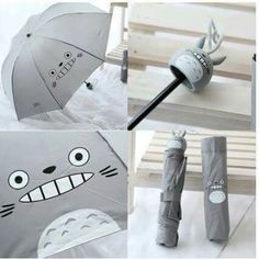 the umbrellas are designed to look like cartoon cats and have faces on them,