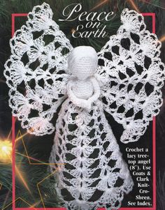 a crocheted angel ornament hanging from a christmas tree