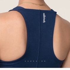 Break A Sweat, Not The Planet With This Medium Support, Fitted Tank With A Built-In Shelf Bra. Made With A Mix Of Sustainable Materials Like Eucalyptus Tree Fibre And Merino Wool, It Wicks Moisture, Dries Quickly And Keeps You Cool For Every Squat, Stretch, And Stride. Use: Running, Training, Walking Material: 43% Tencel Lyocell, 30% Recycled Nylon, 18% Zq Merino Wool, 9% Elastane Fit: Fitted, Hits At Waist Compressive, Midweight Fabric Where It's Made: Vietnam. Learn More About Our Operations Blue Medium Support Tank Top, Blue Tops With Built-in Bra For Everyday, Everyday Blue Top With Built-in Bra, Everyday Blue Tops With Built-in Bra, Blue Racerback Crop Top With Built-in Bra, Blue Casual Tops With Medium Support, Casual Blue Tops With Medium Support, Blue Racerback Top With Medium Support, Blue Racerback Crop Top Casual