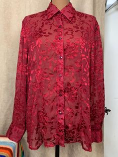 Notations Ruby Red Sheer and Velvet Floral Long Sleeve Blouse  Great for autumn and winter. Beautiful jewel toned red velvety textured floral on a sheer long sleeve, button up,  collared blouse. Size and material tags removed  Measures as a LARGE  please check your measurements for size accuracy. Measurements taken flat Shoulder to shoulder 17 inches Pit to pit 20.5 inches Collar to bottom 26.5 inches  Sleeve 18 inches  Since all sales are final, i am happy to answer any questions . Collared Blouse, Sheer Long Sleeve, Collar Blouse, Jewel Tones, Ruby Red, Autumn And Winter, Womens Clothing Tops, Sleeve Blouse, Blouses For Women