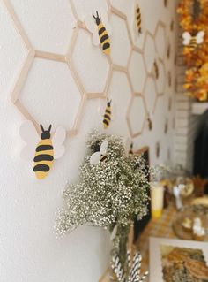 the bees are hanging on the wall