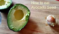 an avocado is cut in half on a cutting board