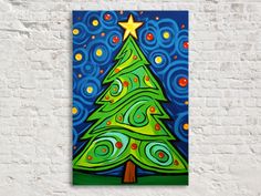 a christmas tree painted on a brick wall