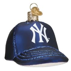 a new york yankees baseball cap ornament hanging from a string on a white background