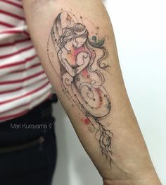 a woman with a tattoo on her arm