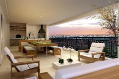 a living room filled with furniture on top of a hard wood flooring covered patio