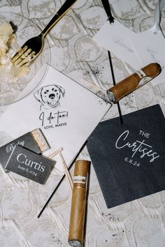 a table topped with different types of cigars and paper napkins on top of it