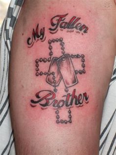 a man with a tattoo on his arm that says, my father and brother