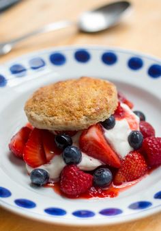 a dessert with strawberries and blueberries on a plate