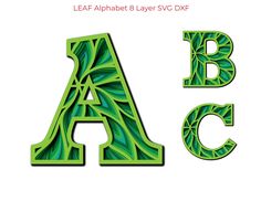 the letter a is made up of green leaves and has an intricate design on it