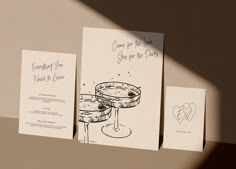 three greeting cards with wine glasses on them, one for the bride and one for the groom