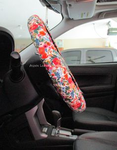 the interior of a car with an umbrella hanging from it's center console area