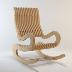 a wooden rocking chair sitting on top of a white floor