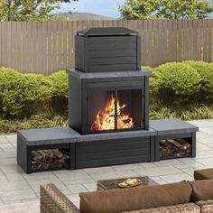 a fire place sitting in the middle of a patio